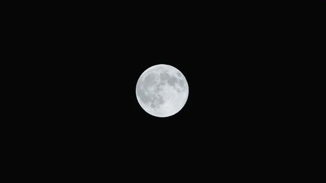 Full moon at night with dark sky.