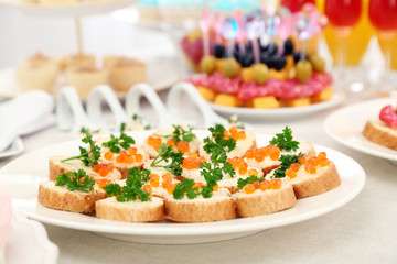 Set of cold snacks, canape, beverages, closeup