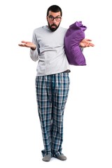 Man in pajamas making unimportant gesture