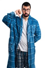 Man in dressing gown doing bad signal