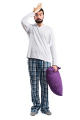 Man in pajamas having doubts