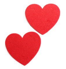 Red felt hearts isolated on white background