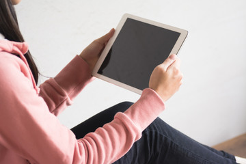 Asian girl use pad at home