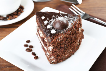 Piece of chocolate cake in white plate closeup