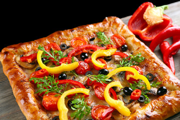 Freshly homemade pizza on black background