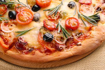 Delicious fresh pizza on napkin closeup