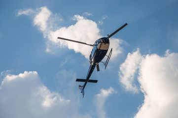 Fototapeta na wymiar Blue helicopter in the air