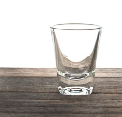 empty wisky glass on wooden texture