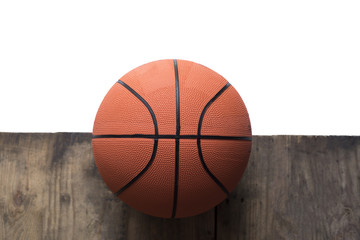 Basketball on old wood table and white background