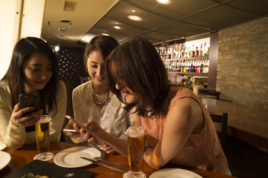 Three women have seen the photos on smartphones
