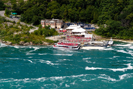 Color DSLR stock image of the pool beneath Niagara Falls with boat and tourists; horizontal with copy space for text