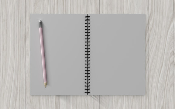 Blank note paper with pencil. on wood background
