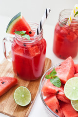 Watermelon slices with lime and smoothie
