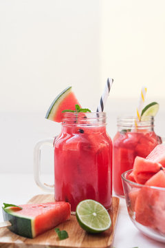 Watermelon juice and slices with lime