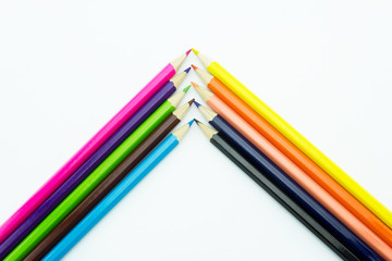 Corner from multicolored pencils isolated on white background.