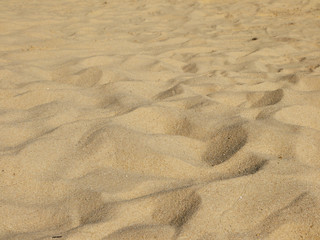 closeup of sand pattern of a beach in the summer