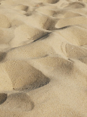 closeup of sand pattern of a beach in the summer
