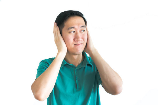 Stressed man covering his ears and do not want to hear, noise too loud