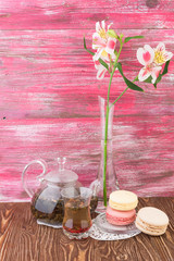 exotic green tea with flowers in glass teapot