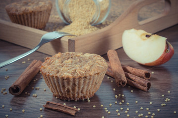 Vintage photo, Fresh muffins with millet groats, cinnamon and apple baked with wholemeal flour, delicious healthy dessert