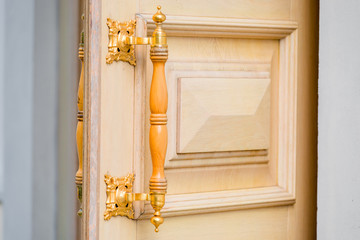 part of the door with the handle in vintage style close-up