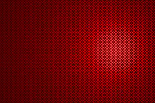 spotlight on red metallic mesh background.