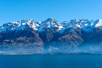 Lake Wakatipu landscape with snow covered mountains