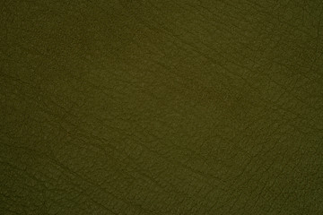 Green leather texture closeup, useful as background