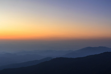 Layer of mountain and skyline after sunset