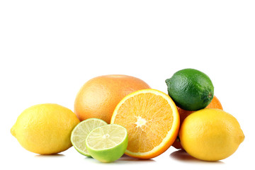 delicious and healthy, whole and cut into pieces the citrus fruit isolated on white background lie in a heap