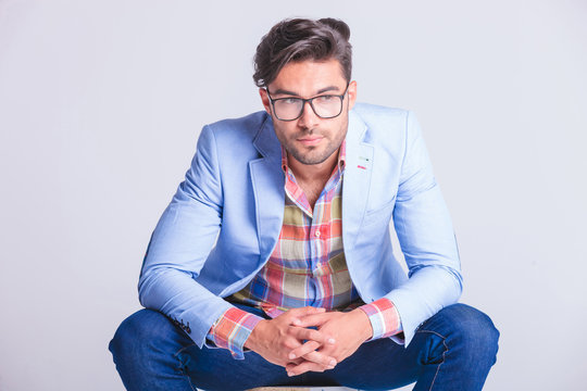 close portrait of attractive casual man wearing glasses