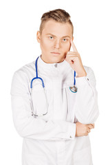 Young  male doctor in white coat and stethoscope thinking of som