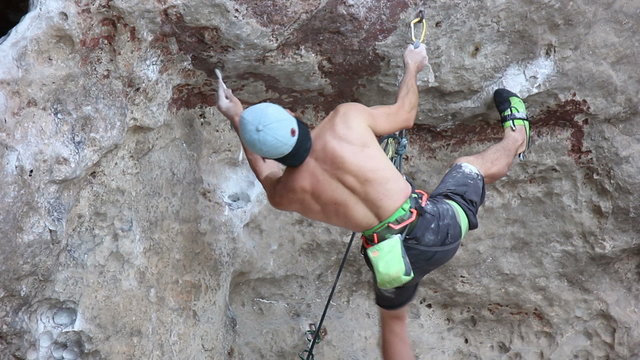 Man Alpinist Climbing on Rock