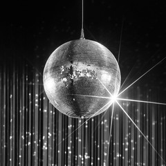 Party disco ball with stars in nightclub with striped walls lit by spotlight, nightlife entertainment industry, monochrome - 102796948