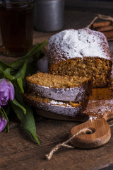 cake with honey, coconut and spices on wooden background