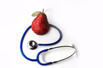 Blue stethoscope and red pear on a white background