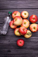 Closed bottle near apples