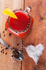 Bloody mary cocktail on wooden table