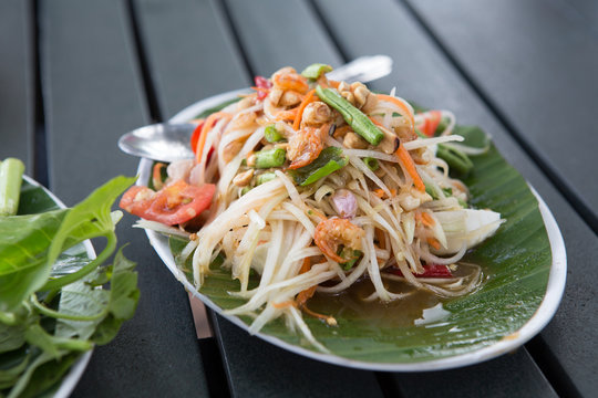 Thai cuisine - hot and spicy papaya salad with salted egg