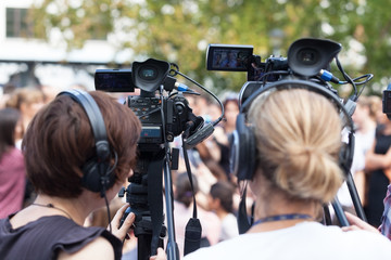 News conference. Filming an event with a video camera.