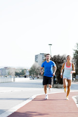 Fototapeta premium A man and a woman jogging