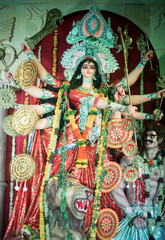 MUMBAI, INDIA - October 20, 2015: An idol of revered goddess Durga standing in the temporary temple in the city of Mumbai during Durga Puja festival celebration.