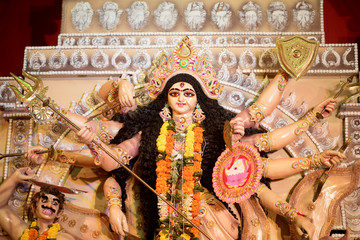 MUMBAI, INDIA - October 20, 2015: An idol of revered goddess Durga standing in the temporary temple...
