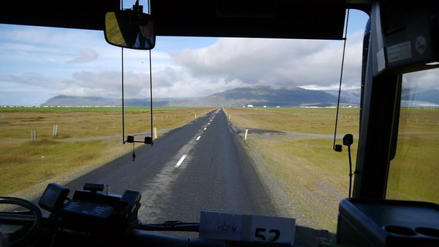 Video footage of a car bus. The road along the south coast. View from the bus. Iceland.