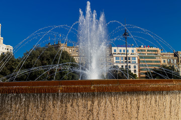 Fototapeta premium Barcelona, Catalunya, Spain - August 28, 2015: Plaza Catalunya view with people on a sunny day. It's the most turistic place in city.