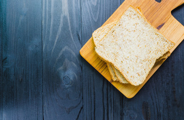 whole wheat bread on wooden board