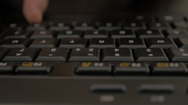 Business woman typing on black keyboard in slow motion while dolly with camera passing by 1080p FullHD footage - Female fingers typing on keyboard in slow-mo 1920X1080 HD video 
