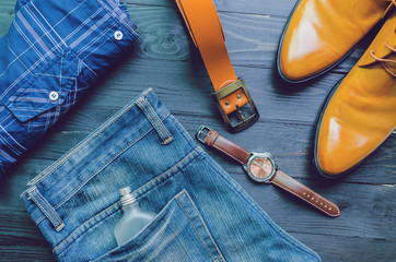 set of clothes and accessories on a wooden background