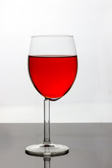 Wine glass with red liquid