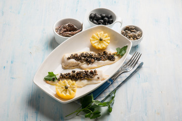 fish fillet with black olives capers and anchovies